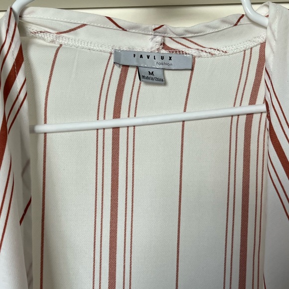 White medium crop top with orange stripes and bell sleeves. Cute and casual. - Picture 5 of 5